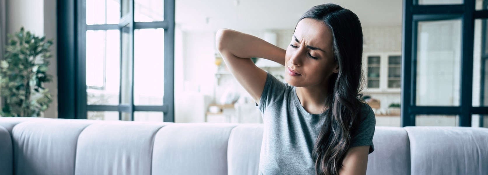 Woman experiencing neck pain
